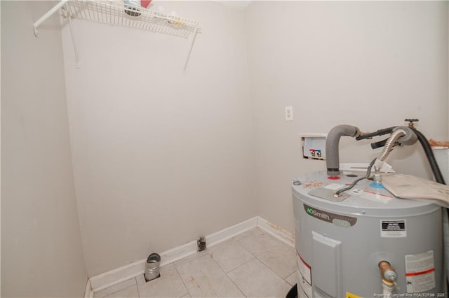 6310 Glenlea Cir, Fayetteville, NC 28314 - laundry room featuring water heater, washer hookup, and light tile patterned flooring