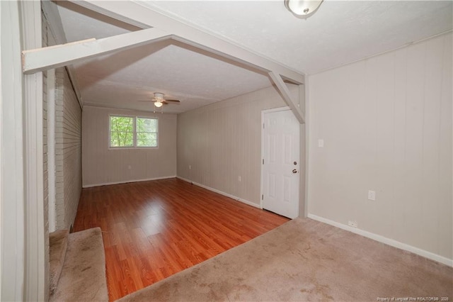 6310 Glenlea Cir, Fayetteville, NC 28314 - empty room with a ceiling fan, wood finished floors, and wooden walls