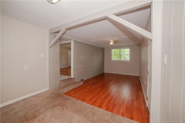 6310 Glenlea Cir, Fayetteville, NC 28314 - unfurnished room featuring ceiling fan, wood finished floors, and brick wall