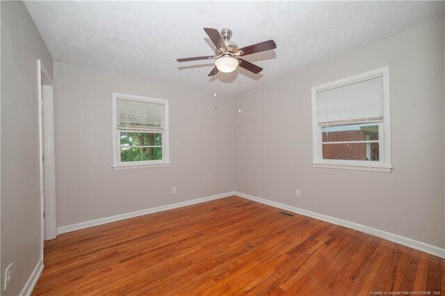 6310 Glenlea Cir, Fayetteville, NC 28314 - spare room featuring light wood-style floors, a textured ceiling, and ceiling fan
