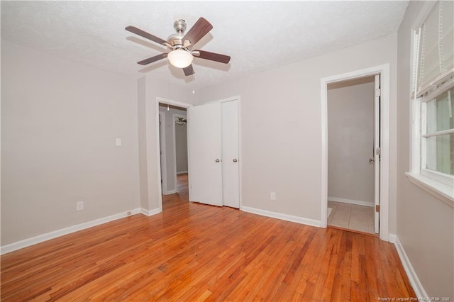 6310 Glenlea Cir, Fayetteville, NC 28314 - unfurnished bedroom with light wood-style flooring, a textured ceiling, and ceiling fan