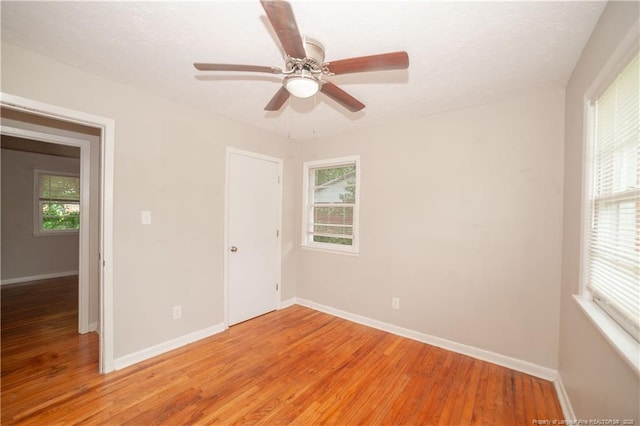 6310 Glenlea Cir, Fayetteville, NC 28314 - empty room featuring light wood-type flooring, plenty of natural light, and ceiling fan