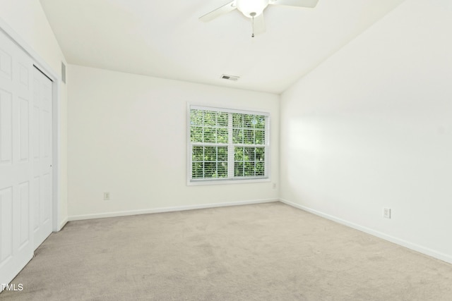 5545 Crabtree Park Ct, Raleigh, NC 27612 - unfurnished bedroom featuring light colored carpet, a closet, a ceiling fan, and vaulted ceiling