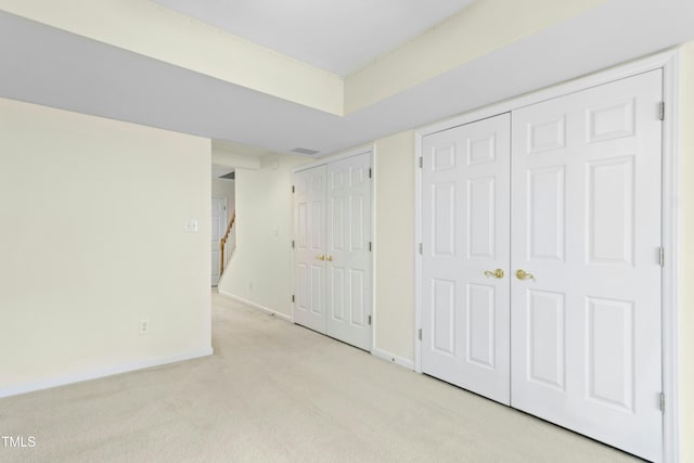 5545 Crabtree Park Ct, Raleigh, NC 27612 - unfurnished bedroom featuring multiple closets and light carpet