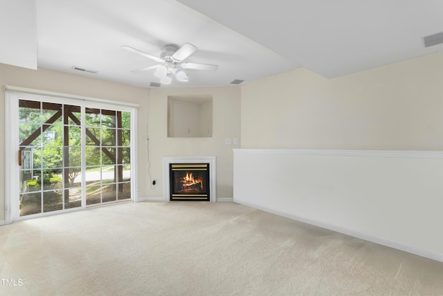 5545 Crabtree Park Ct, Raleigh, NC 27612 - unfurnished living room with carpet floors, a ceiling fan, and a glass covered fireplace