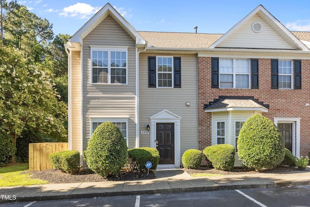 3408 Sosa Rd, Raleigh, NC 27610 - townhome / multi-family property with uncovered parking and a shingled roof