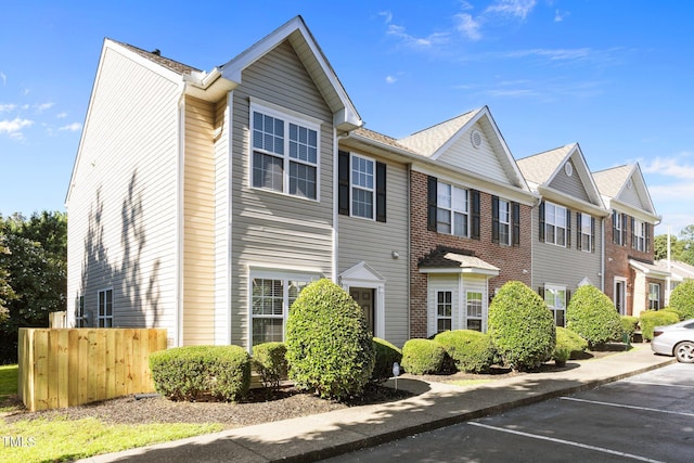 3408 Sosa Rd, Raleigh, NC 27610 - view of front facade with uncovered parking and brick siding