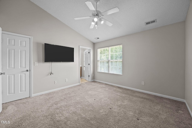 3408 Sosa Rd, Raleigh, NC 27610 - unfurnished bedroom with carpet floors, a textured ceiling, lofted ceiling, ensuite bathroom, and ceiling fan