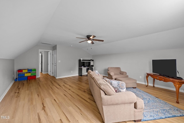 541 Mallie Pearce Rd, Zebulon, NC 27597 - living area featuring lofted ceiling, a ceiling fan, and light wood-type flooring