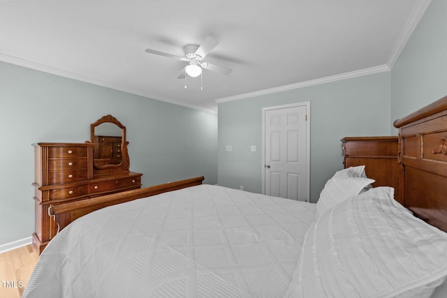 541 Mallie Pearce Rd, Zebulon, NC 27597 - bedroom with ornamental molding, wood finished floors, and a ceiling fan