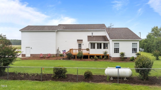 541 Mallie Pearce Rd, Zebulon, NC 27597 - back of house featuring a fenced backyard, a deck, and a shingled roof