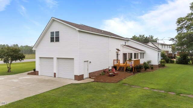 541 Mallie Pearce Rd, Zebulon, NC 27597 - view of side of property featuring a wooden deck, driveway, a yard, an attached garage, and crawl space