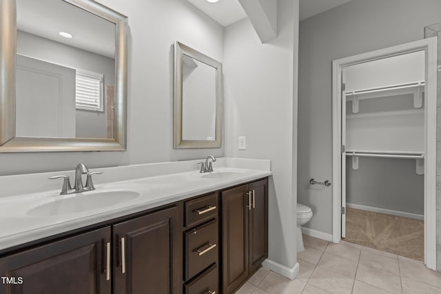 1172 Pemberly Ave, Morrisville, NC 27560 - full bathroom with double vanity, a spacious closet, and tile patterned flooring