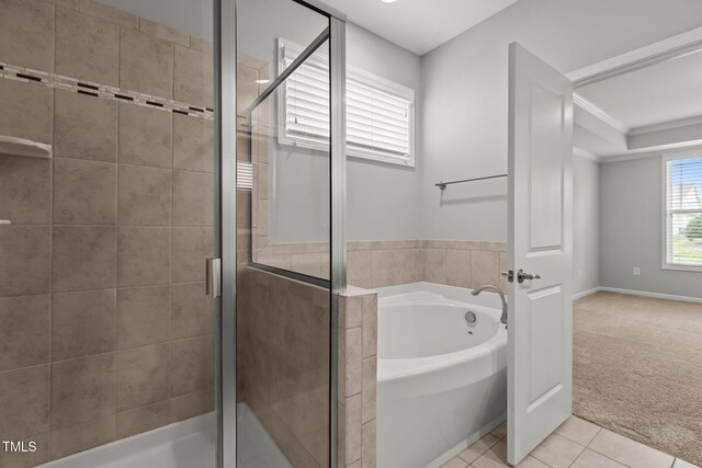 1172 Pemberly Ave, Morrisville, NC 27560 - full bathroom with a bath, tile patterned floors, a stall shower, and ornamental molding
