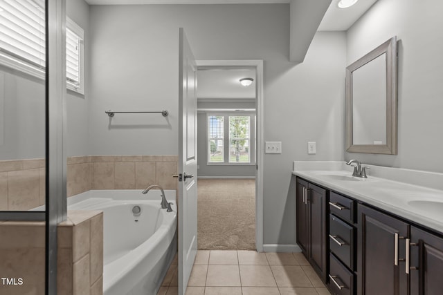 1172 Pemberly Ave, Morrisville, NC 27560 - full bath with double vanity, a garden tub, and tile patterned flooring