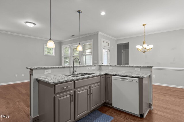 1172 Pemberly Ave, Morrisville, NC 27560 - kitchen with white dishwasher, ornamental molding, gray cabinets, a chandelier, and dark wood-type flooring