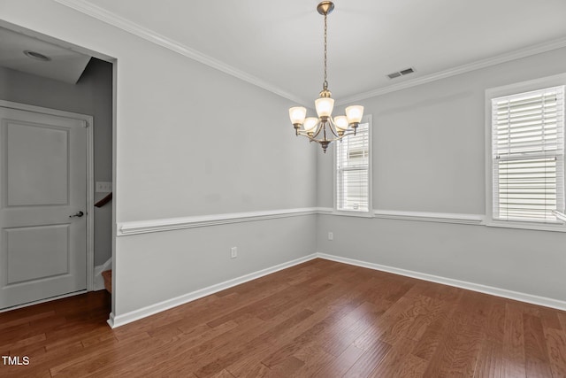 1172 Pemberly Ave, Morrisville, NC 27560 - empty room with a chandelier, wood finished floors, and ornamental molding