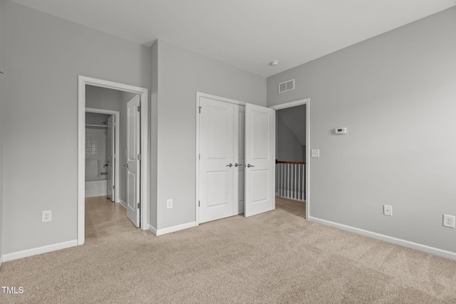 1172 Pemberly Ave, Morrisville, NC 27560 - unfurnished bedroom featuring light carpet, connected bathroom, and a closet
