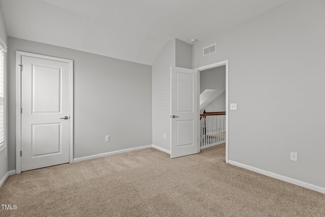 1172 Pemberly Ave, Morrisville, NC 27560 - unfurnished bedroom featuring carpet floors and vaulted ceiling
