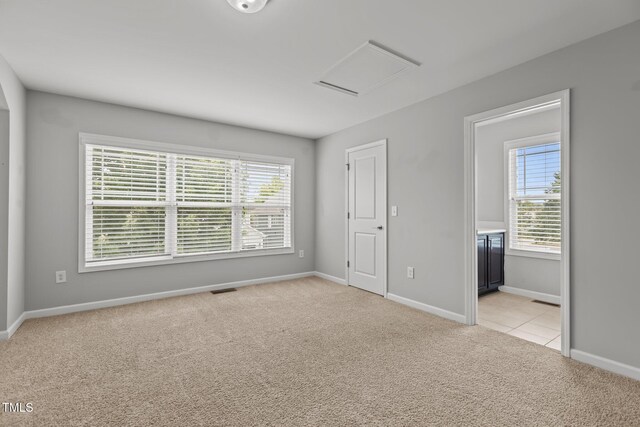 1172 Pemberly Ave, Morrisville, NC 27560 - unfurnished bedroom featuring light colored carpet, attic access, and connected bathroom