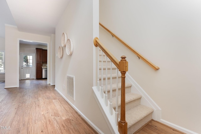 202 Chapel Valley Ln, Apex, NC 27502 - stairs featuring wood finished floors and baseboards