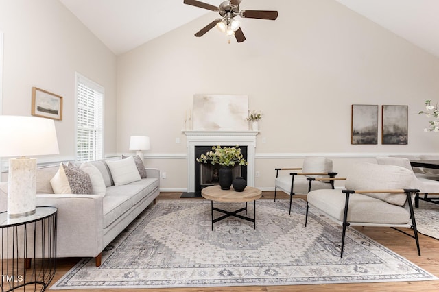 202 Chapel Valley Ln, Apex, NC 27502 - living room featuring high vaulted ceiling, wood finished floors, ceiling fan, and a fireplace