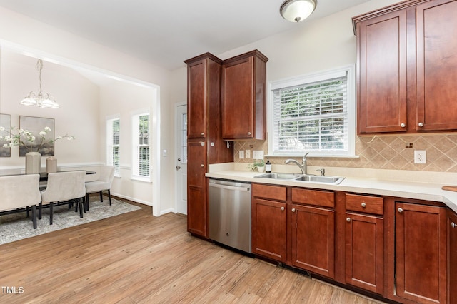 202 Chapel Valley Ln, Apex, NC 27502 - kitchen featuring dishwasher, light wood-type flooring, light countertops, and a chandelier