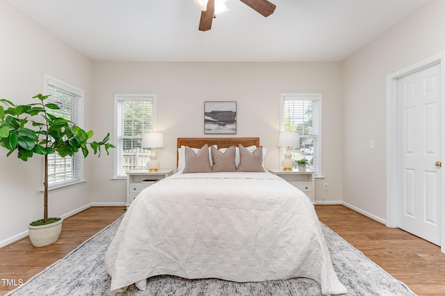 202 Chapel Valley Ln, Apex, NC 27502 - bedroom featuring wood finished floors and ceiling fan