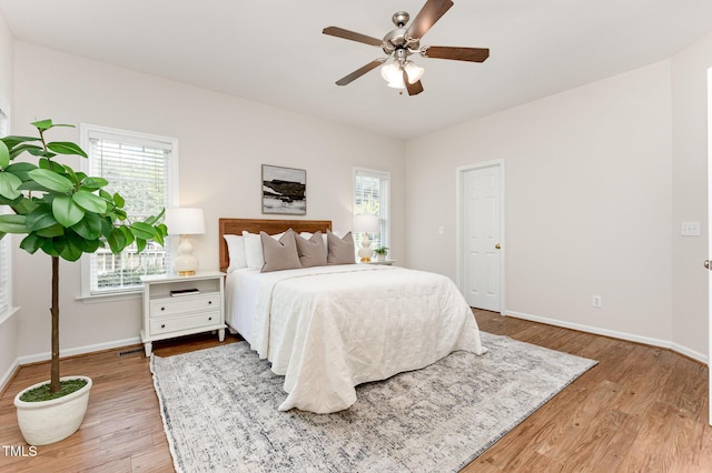 202 Chapel Valley Ln, Apex, NC 27502 - bedroom featuring light wood-style floors and a ceiling fan