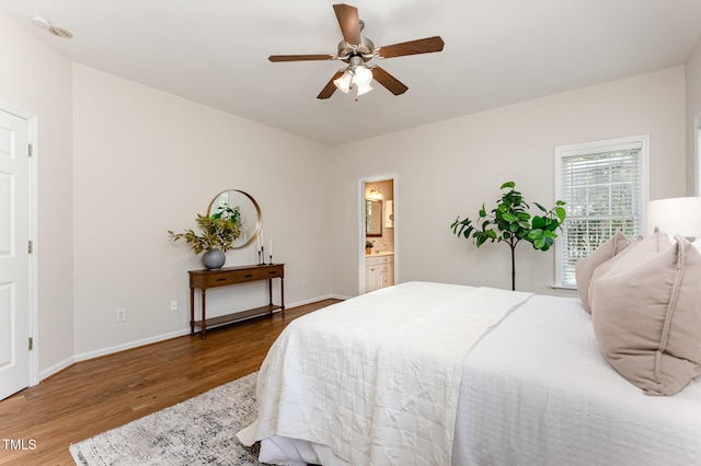 202 Chapel Valley Ln, Apex, NC 27502 - bedroom with wood finished floors, ensuite bath, and a ceiling fan