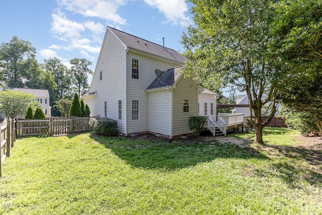 202 Chapel Valley Ln, Apex, NC 27502 - rear view of property with a fenced backyard, a deck, and roof with shingles