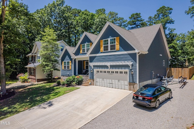 1176 Sagamore Dr, Louisburg, NC 27549 - craftsman house with a garage, driveway, and board and batten siding