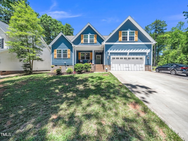 1176 Sagamore Dr, Louisburg, NC 27549 - view of front facade with concrete driveway, covered porch, a front yard, an attached garage, and board and batten siding