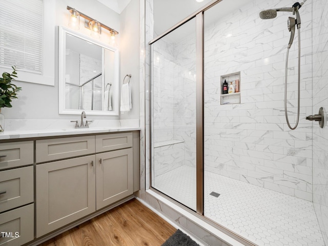 1176 Sagamore Dr, Louisburg, NC 27549 - bathroom with a shower stall, vanity, and wood finished floors