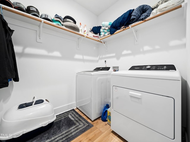 1176 Sagamore Dr, Louisburg, NC 27549 - laundry room with washing machine and dryer and light wood-style floors