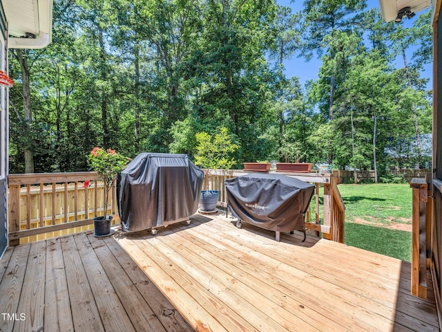 1176 Sagamore Dr, Louisburg, NC 27549 - wooden deck with grilling area and a fenced backyard