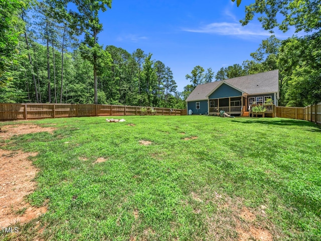 1176 Sagamore Dr, Louisburg, NC 27549 - fenced backyard featuring a sunroom