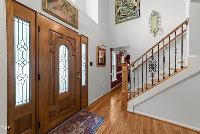 116 Lost Tree Ln, Cary, NC 27513 - entrance foyer with hardwood / wood-style floors, stairs, and a high ceiling