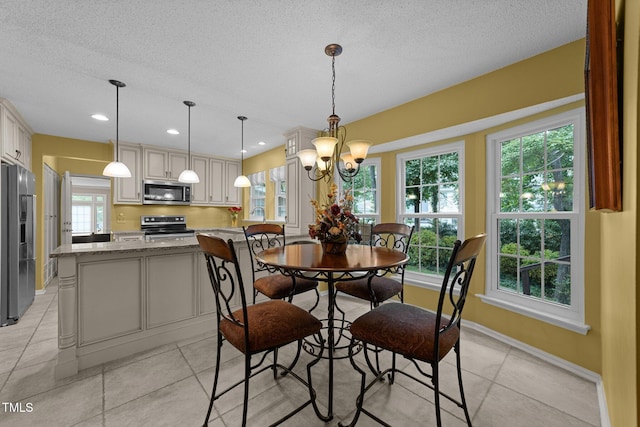 116 Lost Tree Ln, Cary, NC 27513 - dining space featuring a textured ceiling, light tile patterned flooring, a chandelier, and recessed lighting