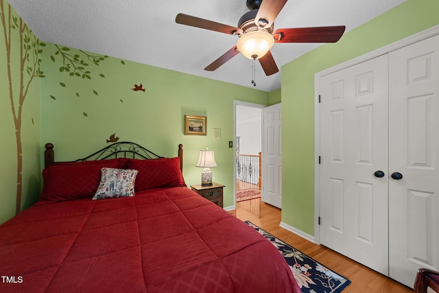 116 Lost Tree Ln, Cary, NC 27513 - bedroom with light wood finished floors, a ceiling fan, and a closet