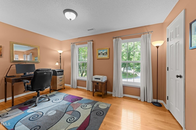 116 Lost Tree Ln, Cary, NC 27513 - home office featuring light wood-style floors and a textured ceiling