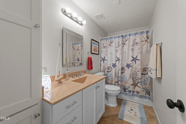 116 Lost Tree Ln, Cary, NC 27513 - bathroom with vanity, tile patterned flooring, and a textured ceiling