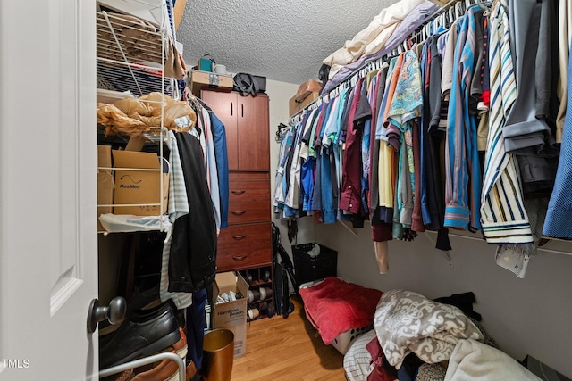 116 Lost Tree Ln, Cary, NC 27513 - walk in closet with wood finished floors