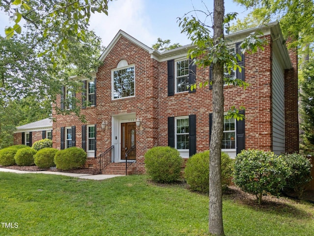 116 Lost Tree Ln, Cary, NC 27513 - view of front facade with brick siding and a front yard