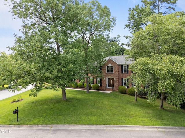 116 Lost Tree Ln, Cary, NC 27513 - colonial-style house featuring brick siding and a front yard