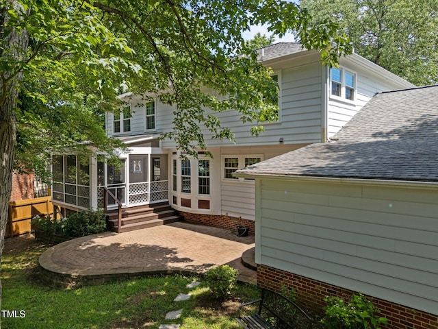 116 Lost Tree Ln, Cary, NC 27513 - back of property featuring a sunroom, a shingled roof, and a patio