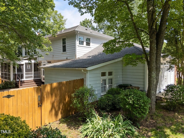 116 Lost Tree Ln, Cary, NC 27513 - rear view of property with a shingled roof and a sunroom