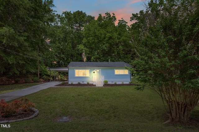 1605 Nixon St, Durham, NC 27707 - view of front of house featuring crawl space, concrete driveway, an attached carport, and a lawn