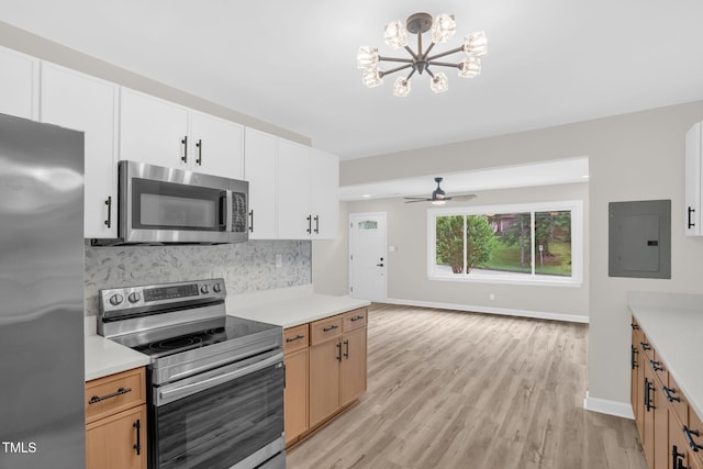 1605 Nixon St, Durham, NC 27707 - kitchen with stainless steel appliances, electric panel, light countertops, and decorative backsplash