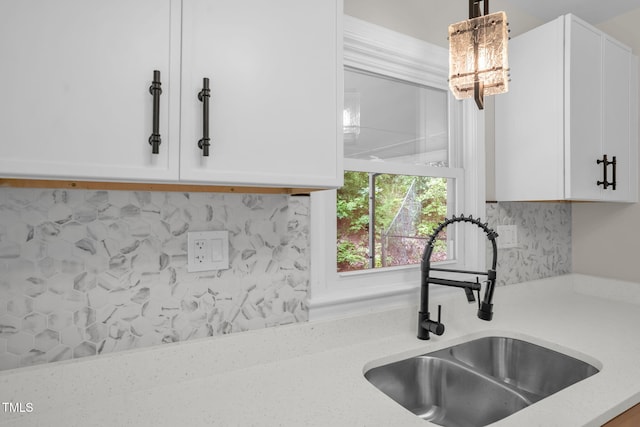 1605 Nixon St, Durham, NC 27707 - kitchen featuring white cabinets, backsplash, and hanging light fixtures